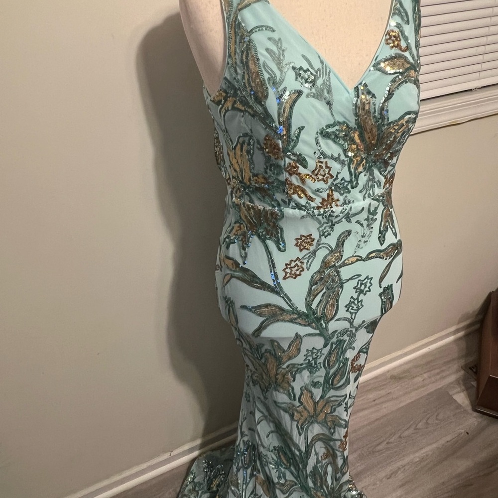 Aqua Floral Sequin Maxi Dress Pit to
Pit 18 inches stretches to 21 inches